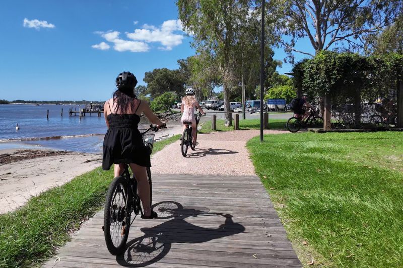 Riders on Bike On Bike Tour next to the Noosa river near Noosa