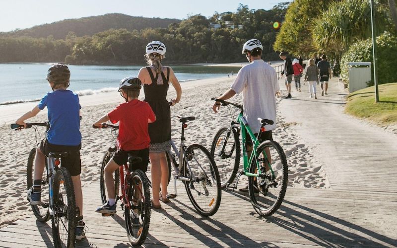 family bike riding in noosa