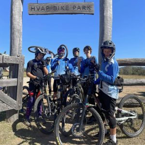 Development Program riders at the HVAP Bike Park gate on a road trip