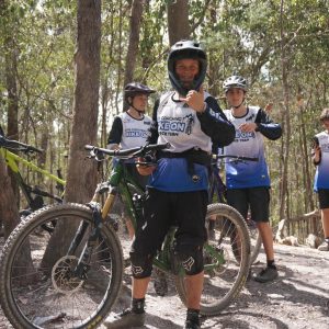 Older riders in Bike On jerseys on the trail during a holiday clinic